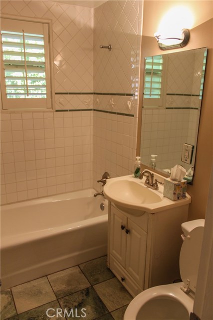 414 A: Hall bath with tile flooring.