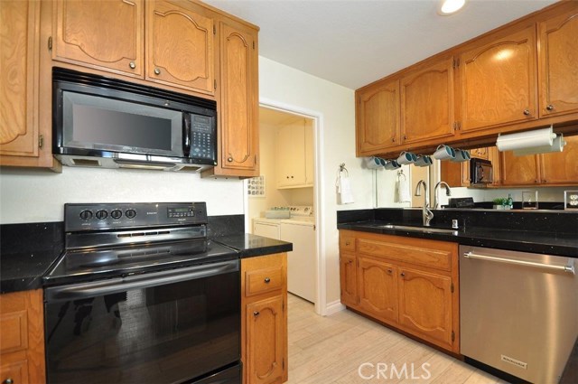 Kitchen with adjacent laundry room.