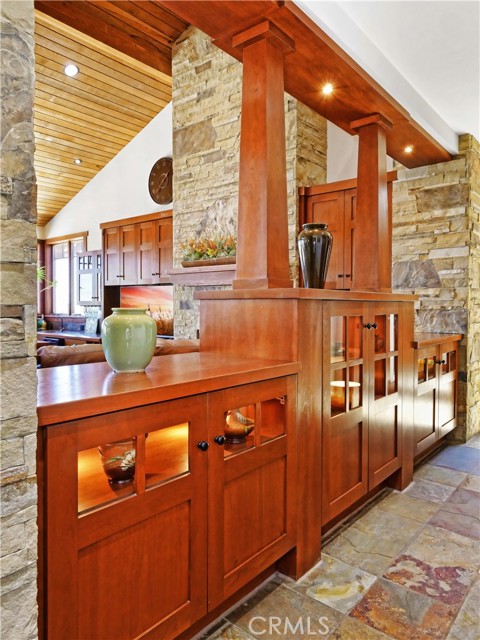 Hall built-in Craftsman-style bookshelves and cabinetry as seen throughout the house providing coveted storage space.