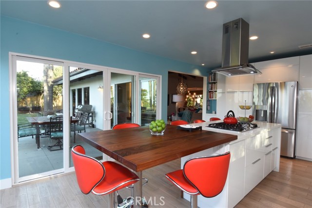 Kitchen with patio/yard access and living room beyond