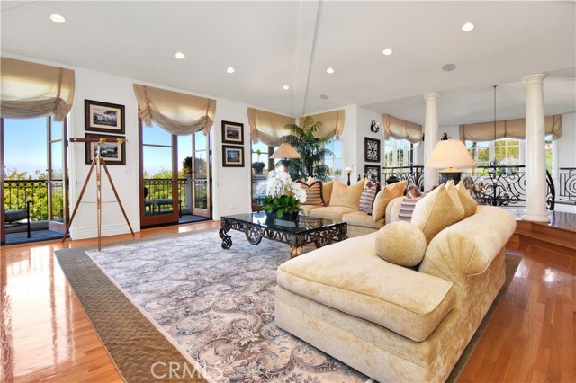 Another view of great room and French Doors opening to terrace and view.