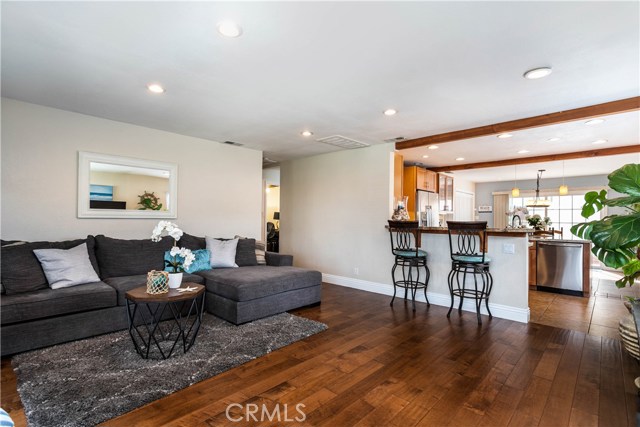Open concept living room, kitchen and dining room feels bright and spacious