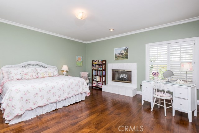 Master bedroom with fireplace and lots of windows