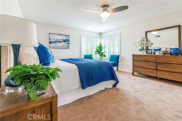 Large Master bedroom with Light fan and outside light