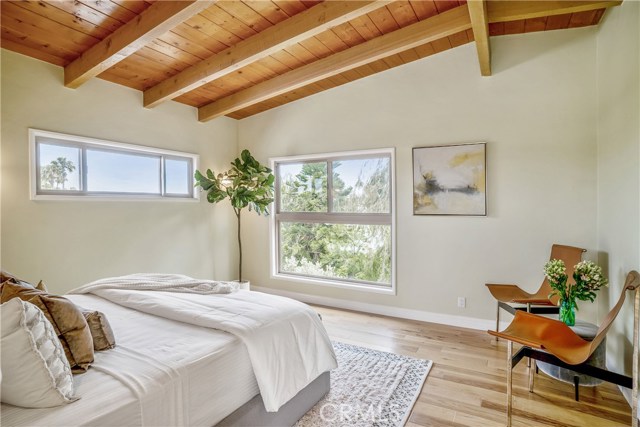 Soaring wood beam ceilings and wide plank hardwood floors, new windows, paint and a spacious open master bedroom suite. At the top of the stairs with a view of the greenery and back yard. Good dreams.