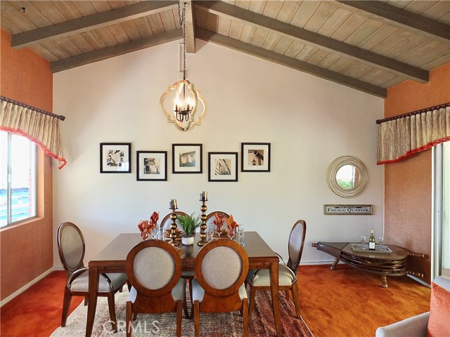 The dining area sits below vaulted ceilings