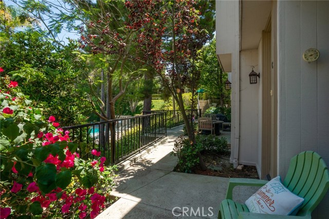 Looking out to the pool and luscious grounds from your patio while sipping on your favorite beverage!