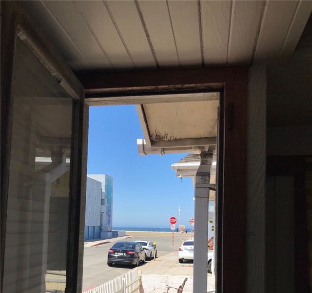 Window on west side of house looking at the Strand and ocean