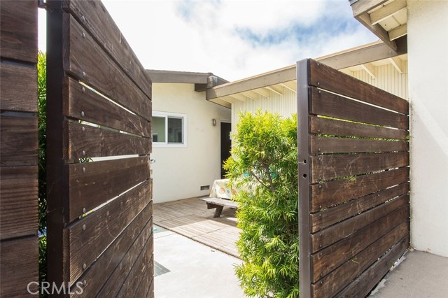 Private back entry to backyard from garage driveway.