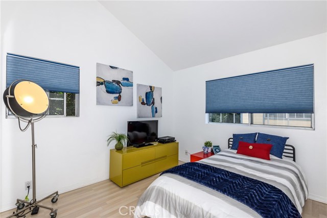 Guest bedroom 1 with high ceiling.