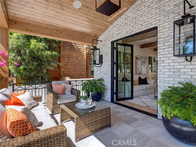 Front porch - Solara natural gas porch lamps, LaCantina door systems, surround sound on porch, sandblasted marble entry tiling, dutch door, security cameras.
