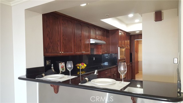 Kitchen with Granite Counters and Recessed Lighting