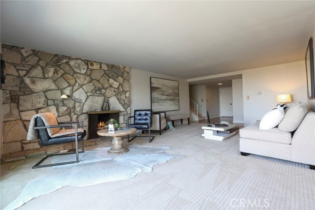 Looking back toward the foyer and half flights of steps to upper or lower levels.