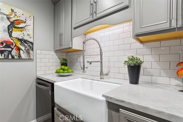 Farmhouse Sink, Quartz Countertops, Custom Cabinets, Subway Tile Backsplash, Black Stainless Steel Dishwasher