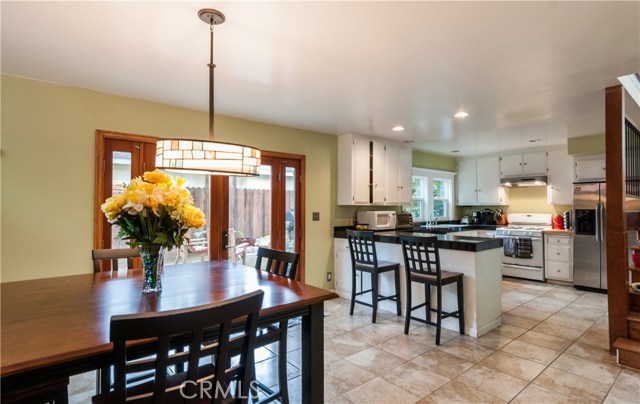 Good view of dining room, kitchen and doors to patio.