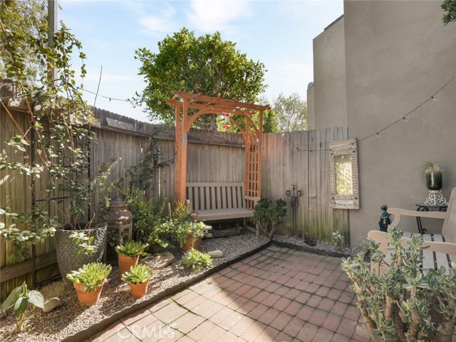 Patio and garden area with bench  and lights