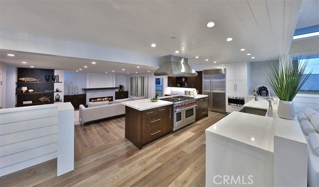 Kitchen opens to family room with fireplace