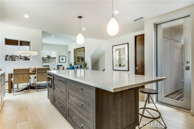  Combo center island with built in Microwave and breakfast bar. Walk in pantry with access to patio deck