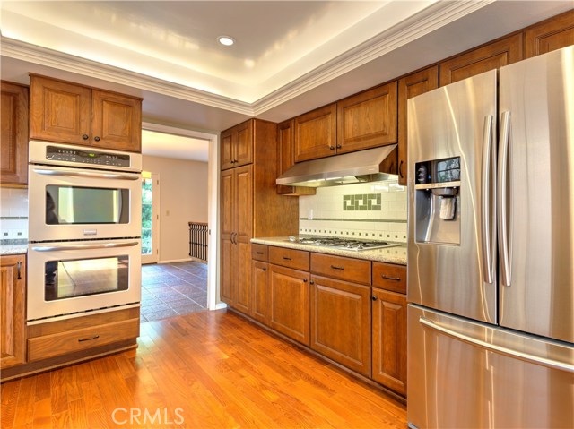 Kitchen is light and bright with side entry and hardwood floors