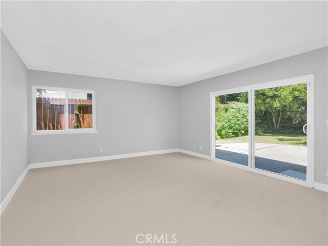 Family room sliding glass doors open to charming enclosed backyard Family room sliding glass doors open to charming enclosed backyard