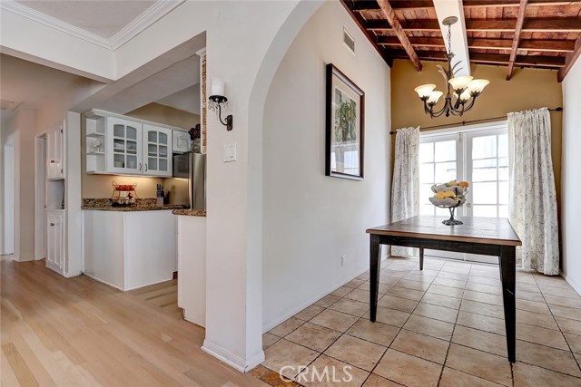 The formal dining room features an open beam ceiling, and adds additional interest.