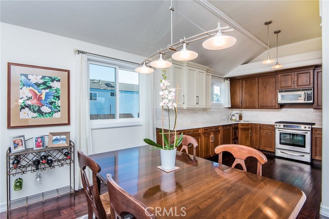 Custom built kitchen with stainless appliances, corian counters, and marble subway backsplash.