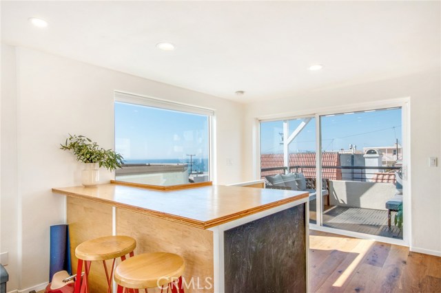 Northwest corner 3rd level with big views deck.  Stairway behind pictured wood surface.