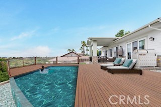 Rendering of the backyard if a pool and deck were added.