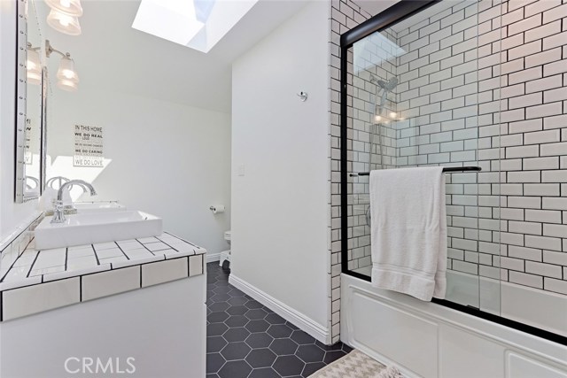 Upstairs Full Bath with Skylight.