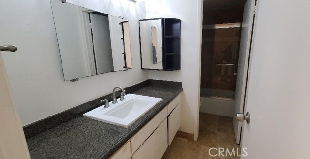 Lower Unit Full Bath Beautifully Upgraded with New counters and Floors and Tub Enclosure.