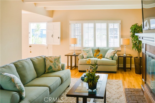 Comfortable living room centered around fireplace.