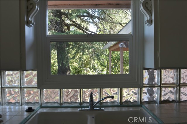 bottle block  and gleaming white kitchen with views of the lake and Mt. Konocti