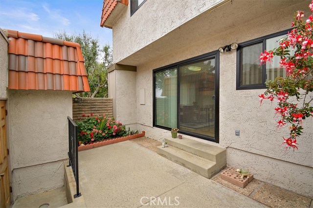 Another view of patio and stairs to garage where washer and dryer are located Another view of patio and stairs to garage where washer and dryer are located