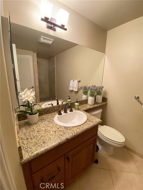 Hallway Bathroom with Granite Counters. Large Mirrors.