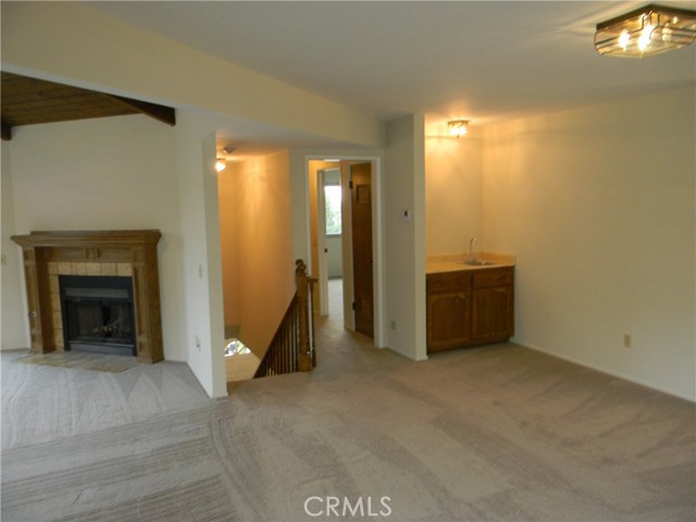 View of Stairwell & bar area, Hall to Master BR
