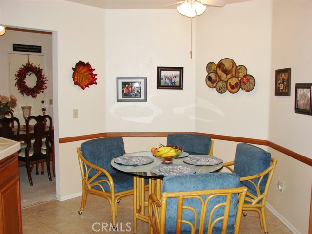 BREAKFAST NOOK OFFERS YOU SPACE FOR INFORMAL DINING IN THE KITCHEN. FORMAL DINING ROOM IN BACKGROUND.