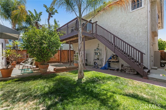 Upstairs unit private yard and side garage entrance