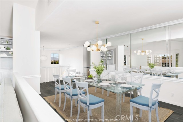 Photo has been altered to show wood being painted white, hardwood floors and new lighting fixture & virtually staged.