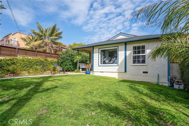 FRONT HOUSE: LARGE FRONT YARD. FACES WEST