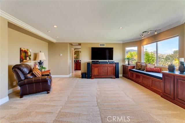 Master bedroom wired with the latest 4K theatre surround sound system and window seating area