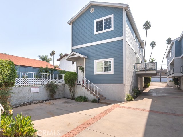 A view of the townhome from the driveway.  Two HOA guest parking spots are conveniently near this unit.