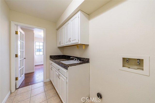 Dedicated laundry room between garage and kitchen. You can never have too much storage!