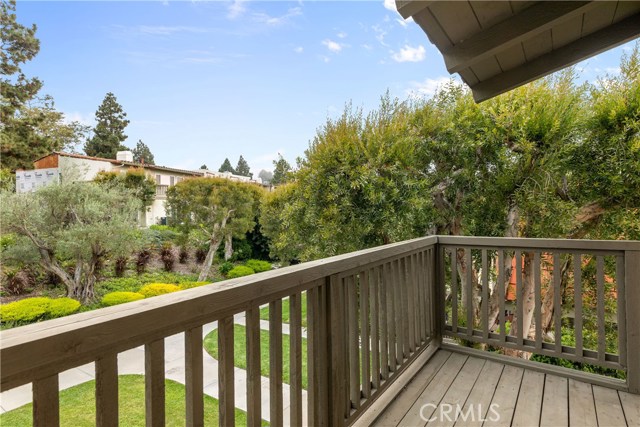 Private deck off Bedroom 3 overlooks the beautiful, lush landscaping.