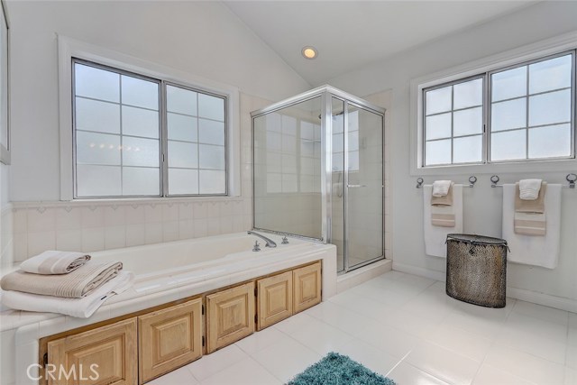 Master Bathroom with Separate Spa Tub and Glass Enclosed Shower