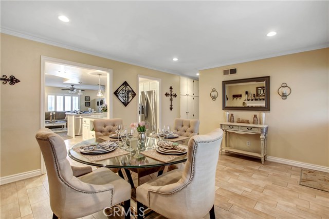 Large Formal Dining Room with a fireplace and picture window viewing front land scape