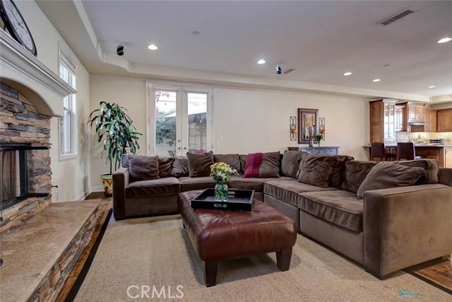 Family room with stacked stone fireplace