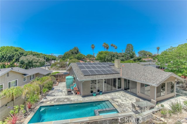 Sparkling pool and spa view from terraced upper level backyard