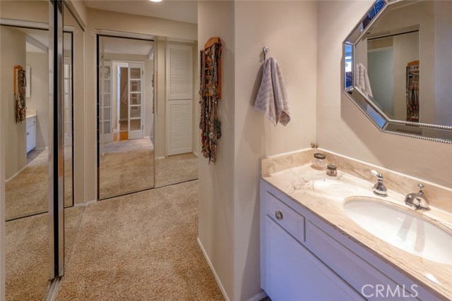 Mirrored wardrobes & custom closets at the Master Dressing Area.