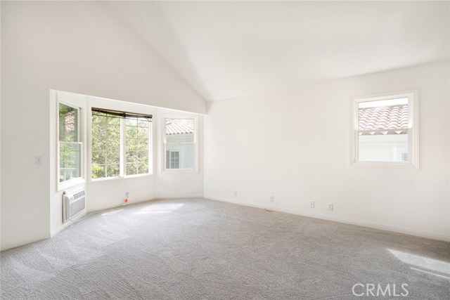 Spacious and sunny master suite with wall a/c, vaulted ceilings and bay window. Totally private room due to mature trees. If Buyers prefer Palos Verdes views, trees can be trimmed down.