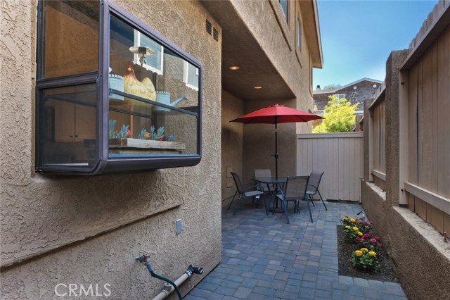 Side patio area with access from the kitchen.  A great space to grill, relax and entertain.